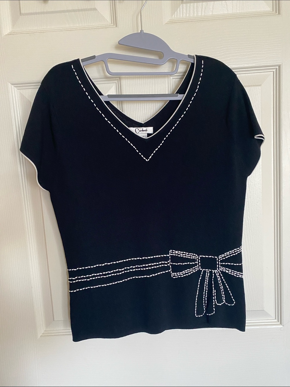 Charming Black V-Neck Short Sleeve Top with White Stitch Bow Detail